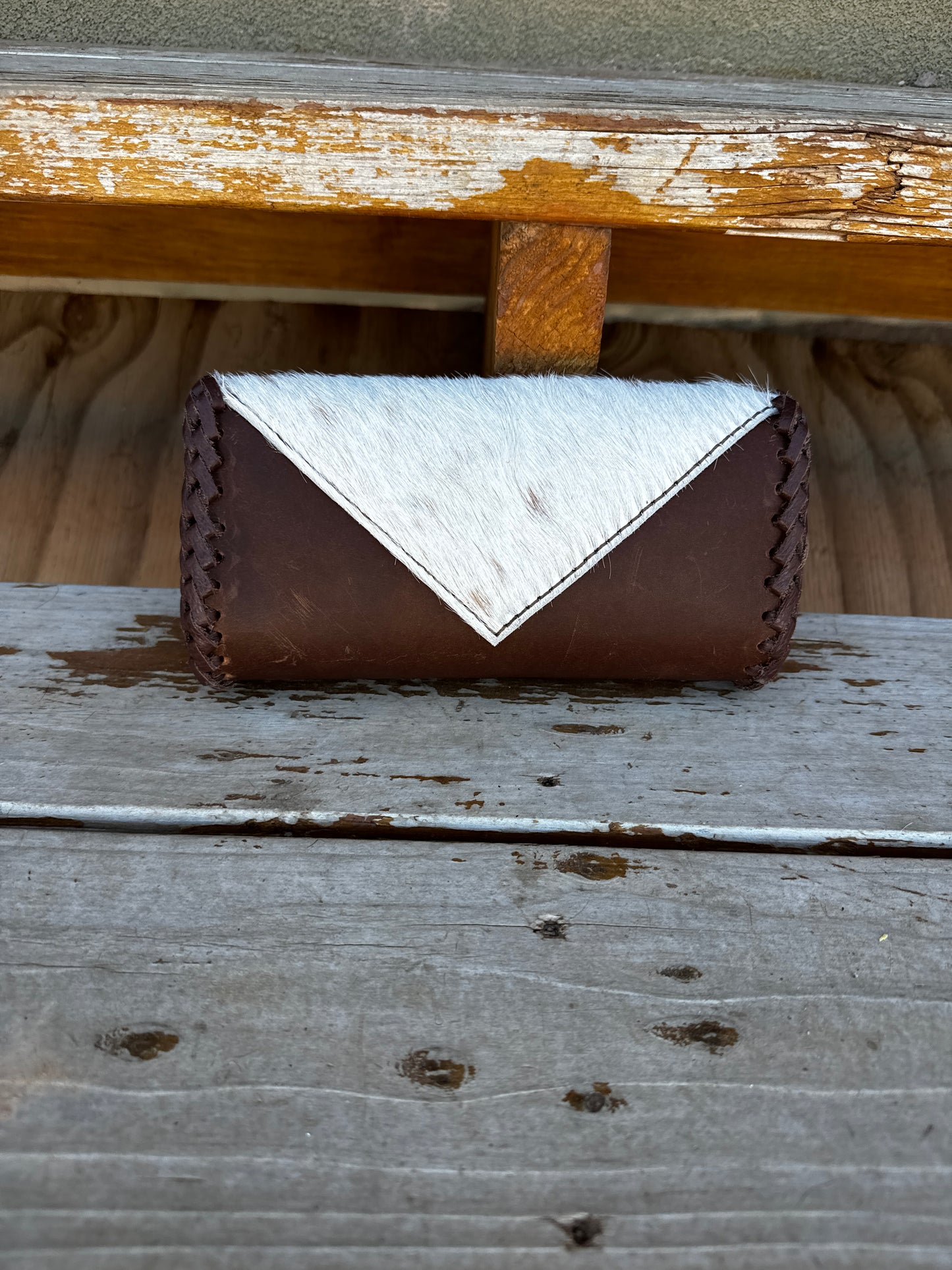 Brown cowhide clutch